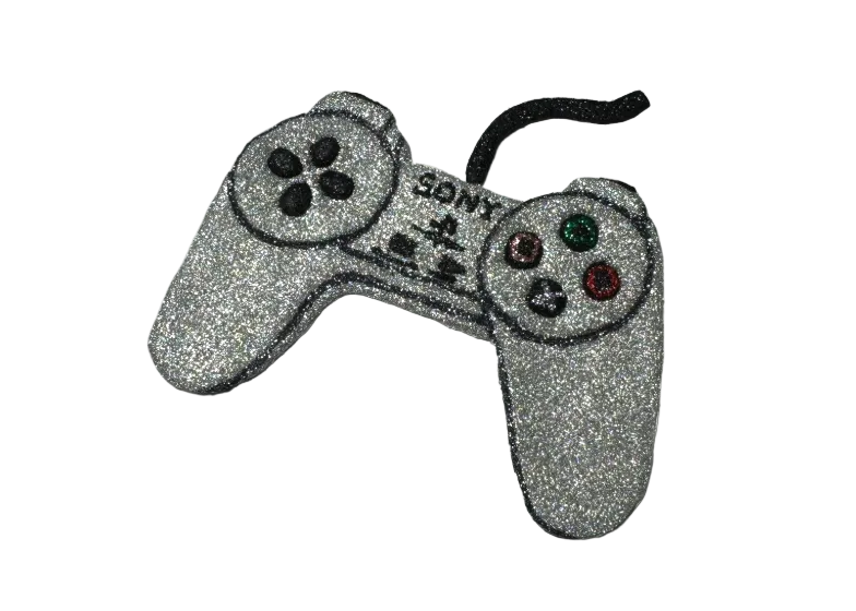 Silver glittery video game controller on a white background